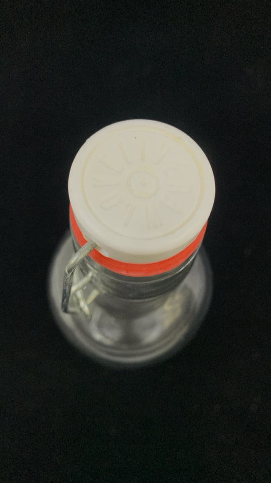 CLEAR RIBBED GLASS BOTTLE W/STOPPER.