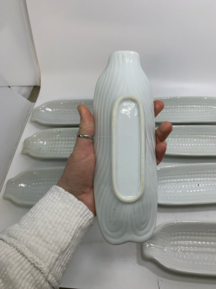 10 WHITE CERAMIC CORN ON THE COB HOLDER PLATES.