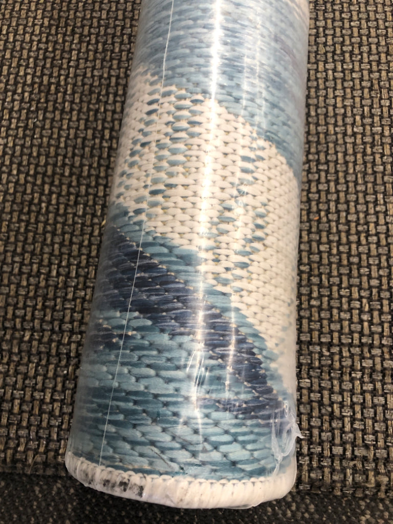 NIP BLUE AND YELLOW BANANA LEAF OUTDOOR RUG.