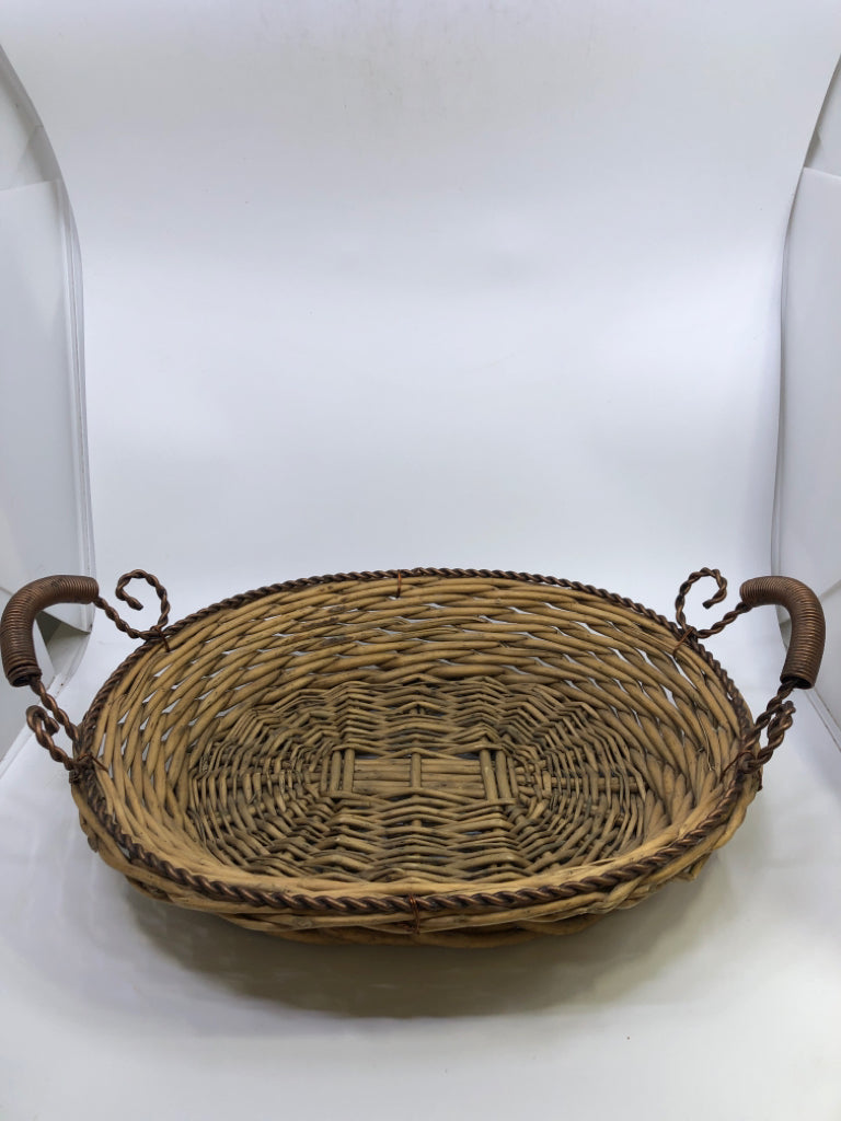 WICKER BASKET W/DECORATIVE METAL HANDLES.
