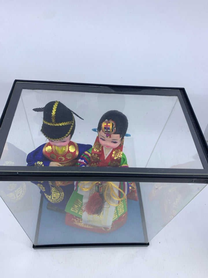 2 ASIAN STYLE DOLLS IN CASE.