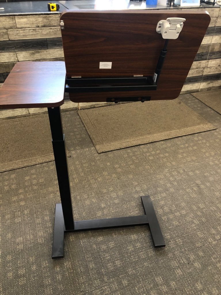 BROWN ADJUSTABLE DESK ON WHEELS.