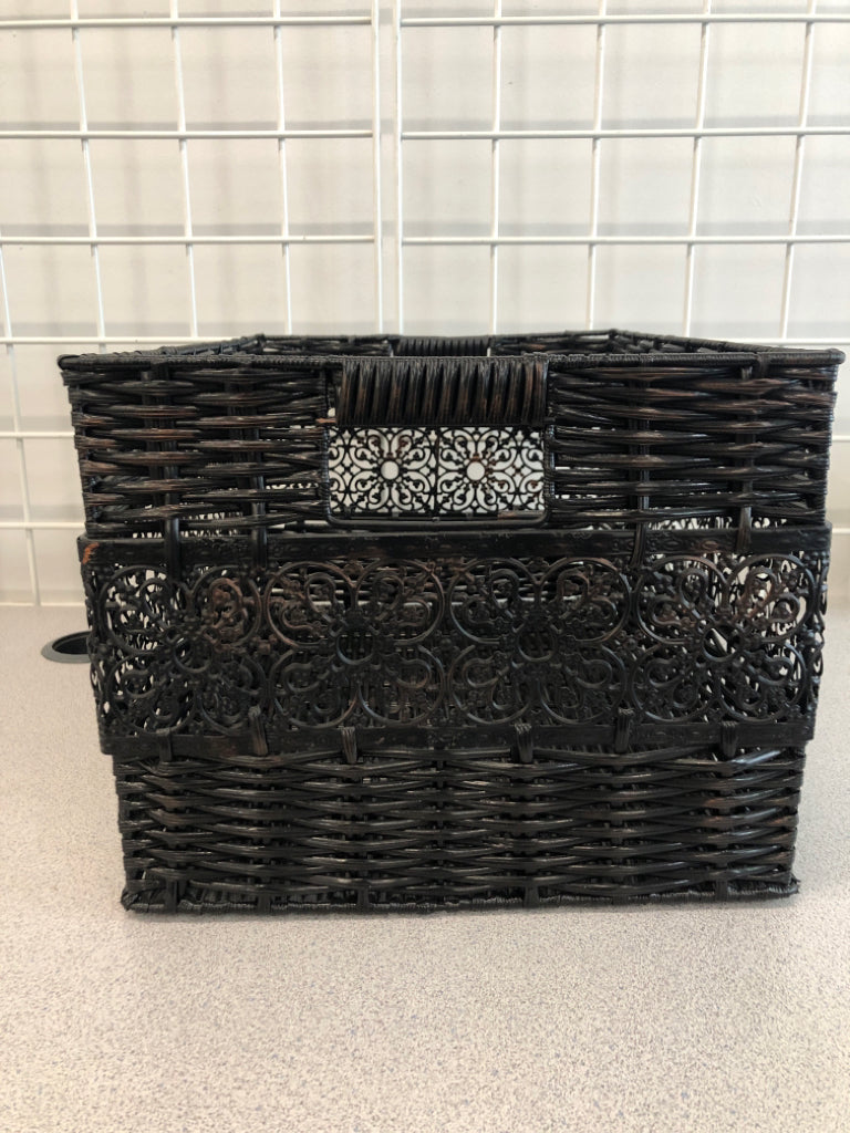 BLACK WOVEN BASKET W/METAL SIDE DETAIL.