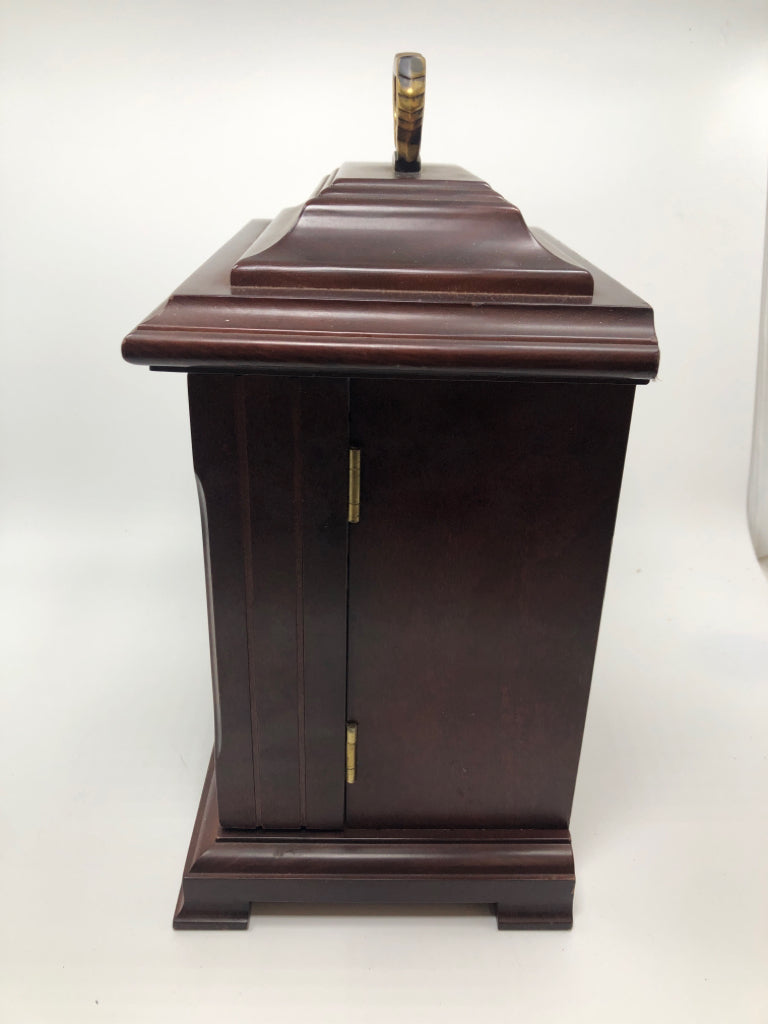 SLIGH CLOCK W/ 3 DRAWERS INSIDE.
