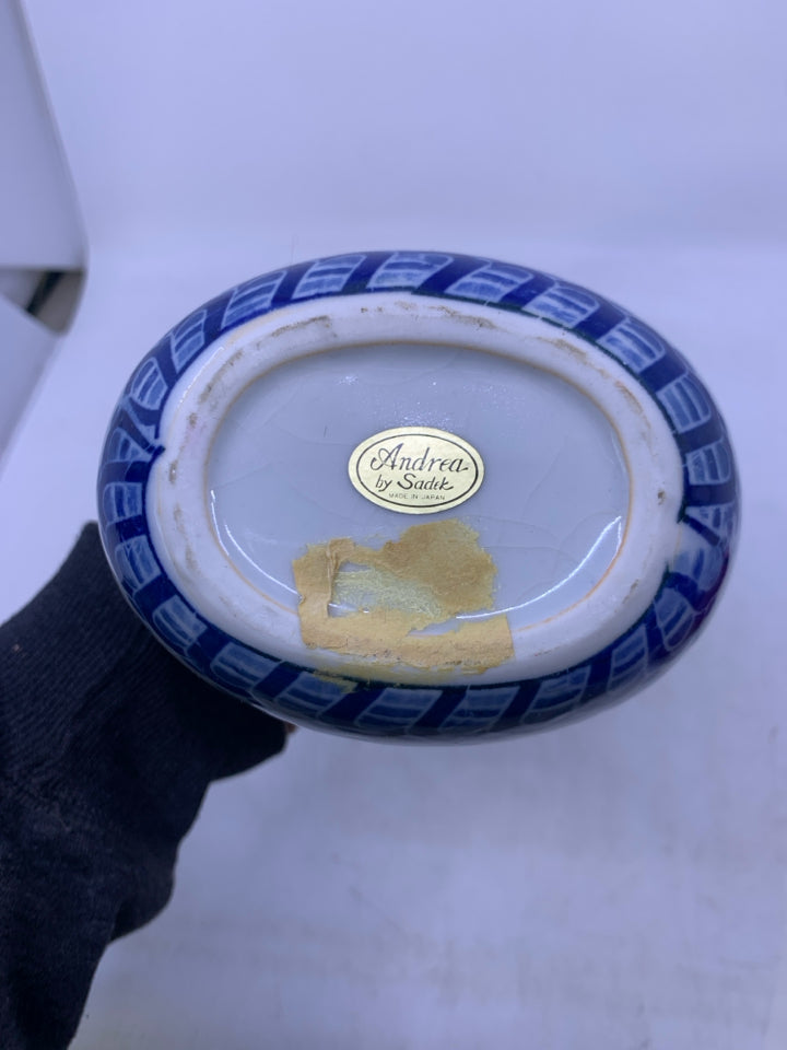 WHITE W/ BLUE FLORAL OVAL CERAMIC VASE.