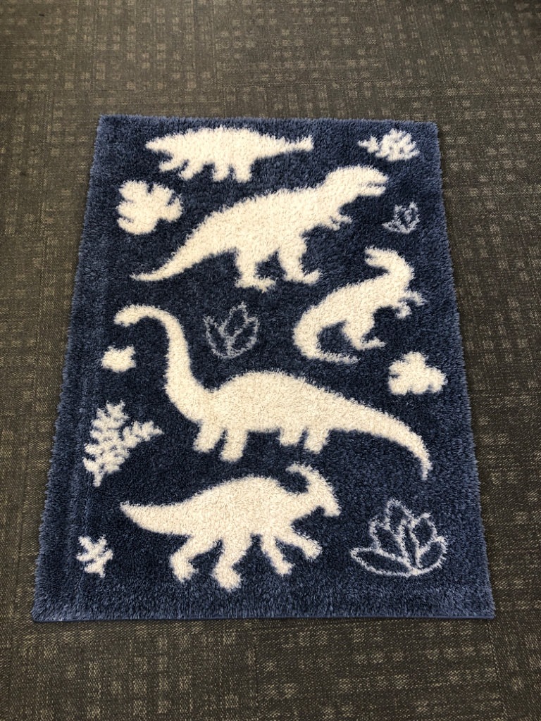 BLUE DINOSAUR WASHABLE RUG.