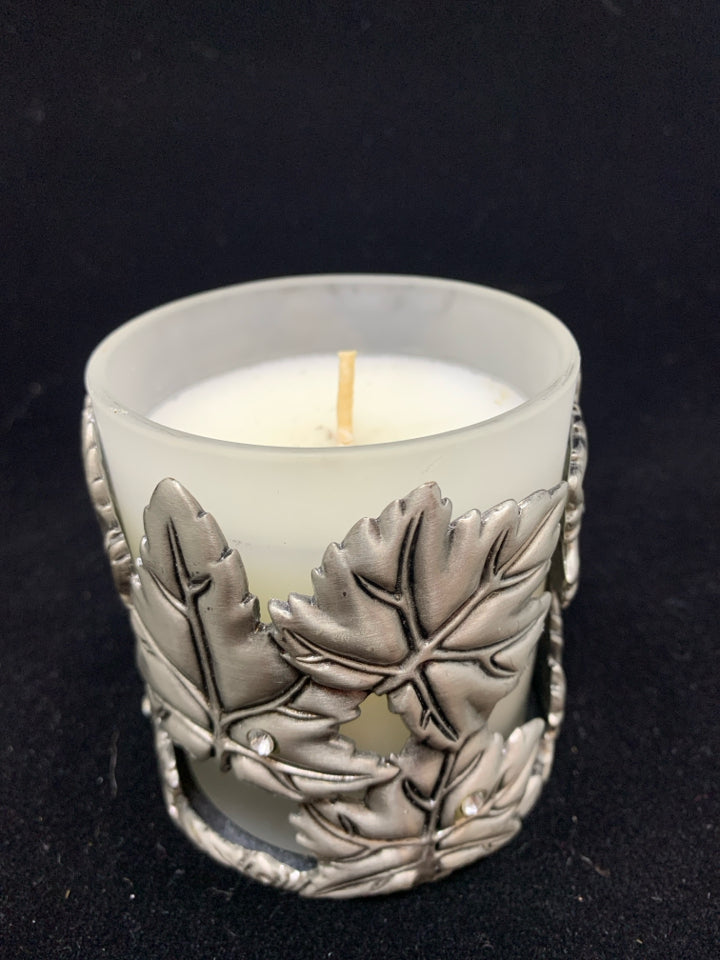 METAL LEAF COVERED CANDLE.