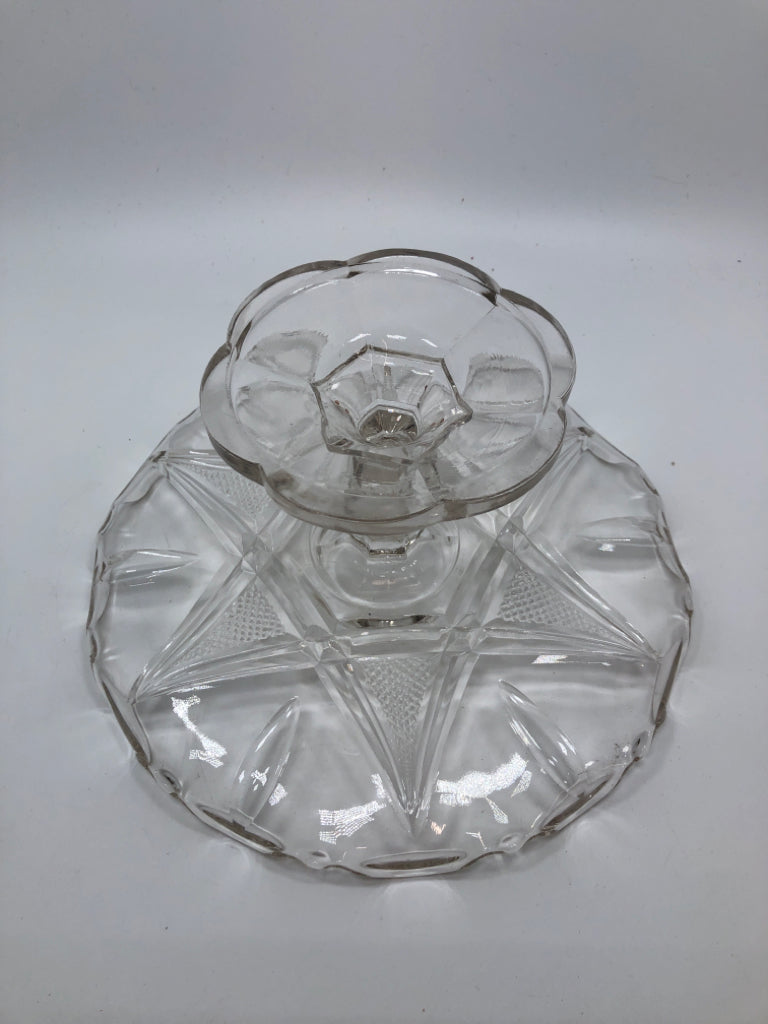 CLEAR GLASS CAKE STAND W/STAR ETCHING.