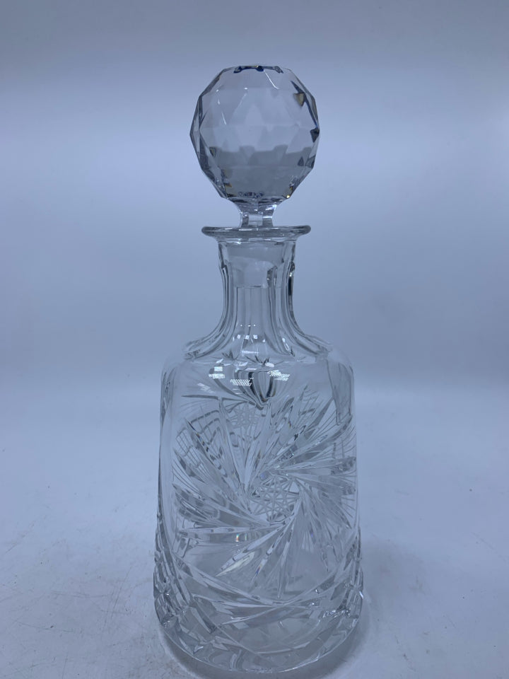 CRYSTAL DECANTER STAR DETAILS AND LARGE BALL STOPPER.