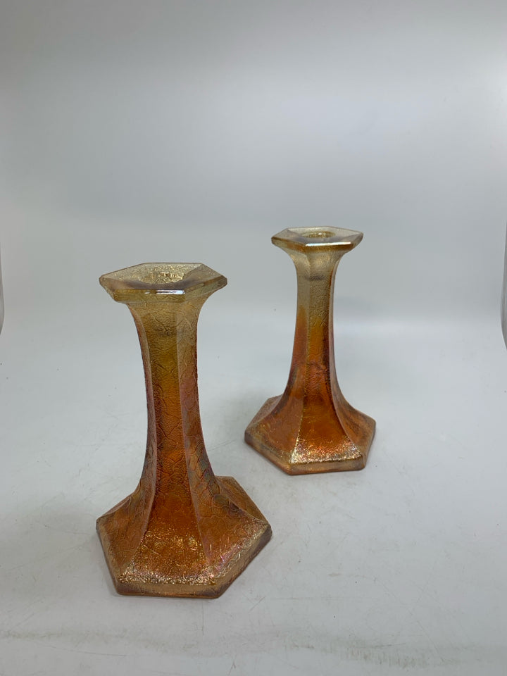2 FOOTED MARIGOLD TEXTURED GLASS TAPERED CANDLE HOLDERS.
