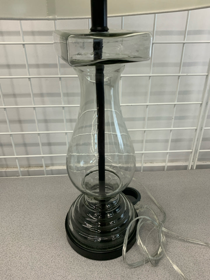 HOLLOW GLASS BASE W/ WHITE SHADE LAMP.