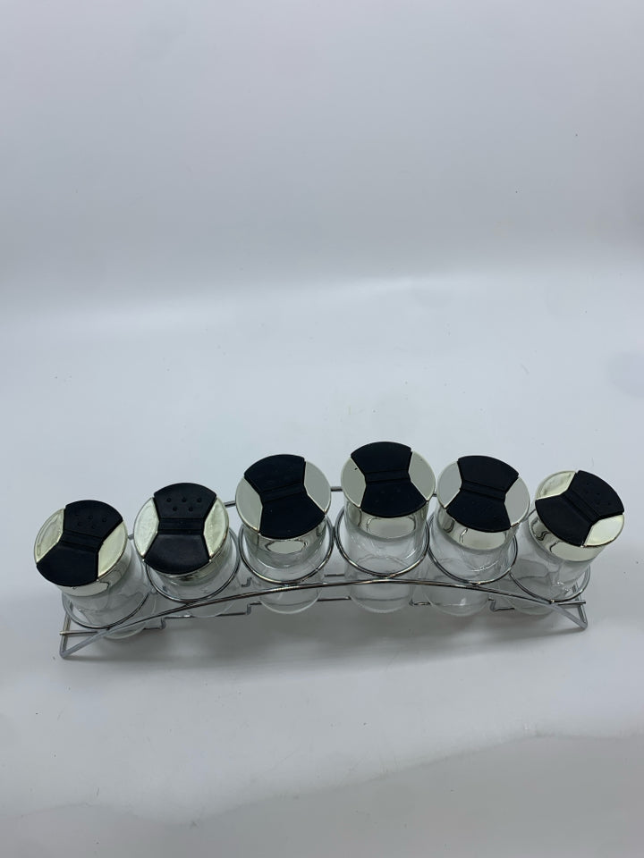 6GLASS SPICE JARS IN METAL STAND.