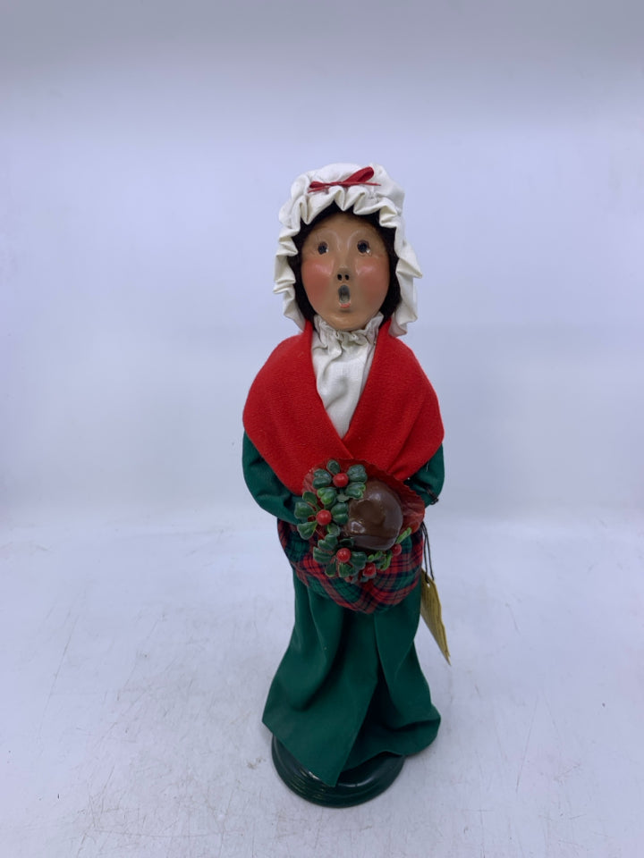 1993 BYERS' CHOICE WOMAN CAROLER WITH FLOWERS.