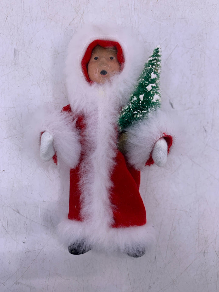 KID HOLDING CHRISTMAS TREE BYERS' CHOICE 1992.