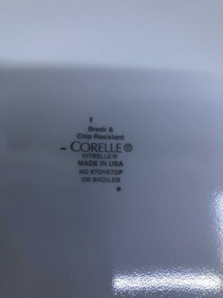 4 WHITE CORELLE DINNER PLATES W/MULTI COLOR SQUARES.