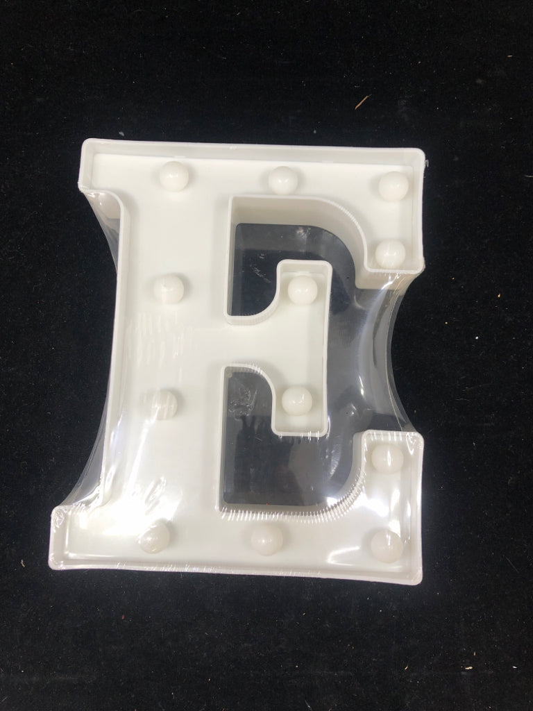 NIP LIGHT UP "E" WHITE SIGN.