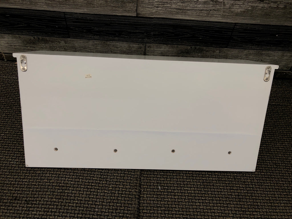 WHITE CUBBY WALL SHELF W/COAT HOOKS.