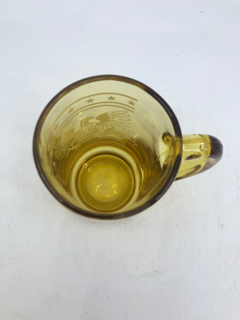 6 AMBER GLASS BEER MUG W/ WHITE PRINTED EAGLE.
