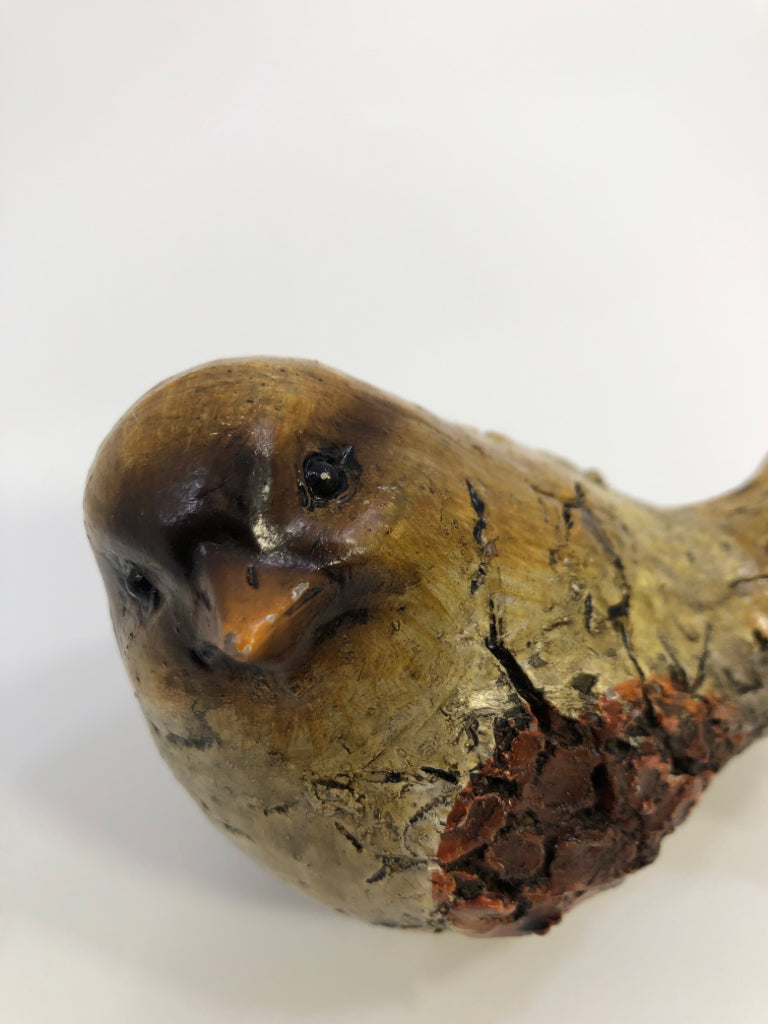 SMALL TEXTURED BROWN BIRD.
