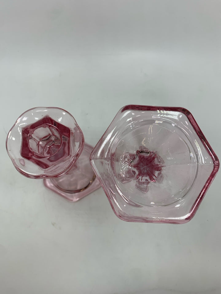 2 PINK GLASS CANDLE HOLDERS.