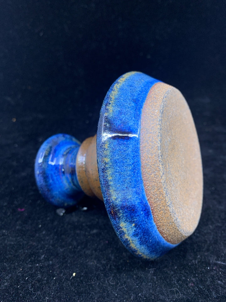 BLUE POTTERY TAPER CANDLE HOLDER.