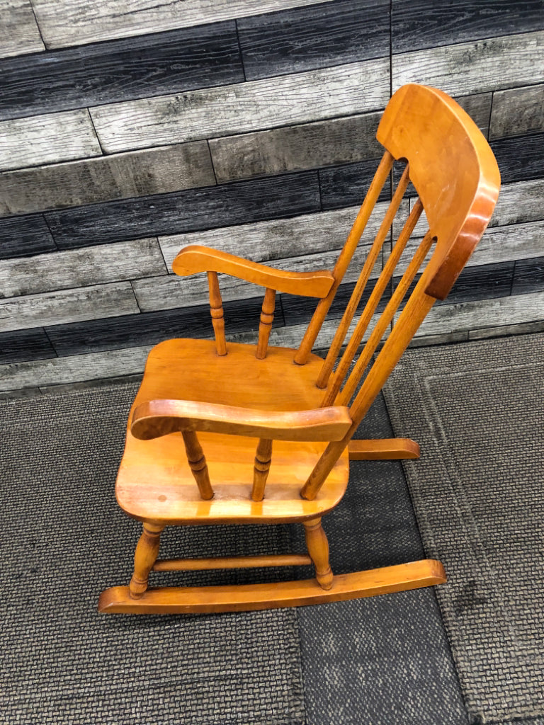 TAN CHILDRENS ROCKING CHAIR.