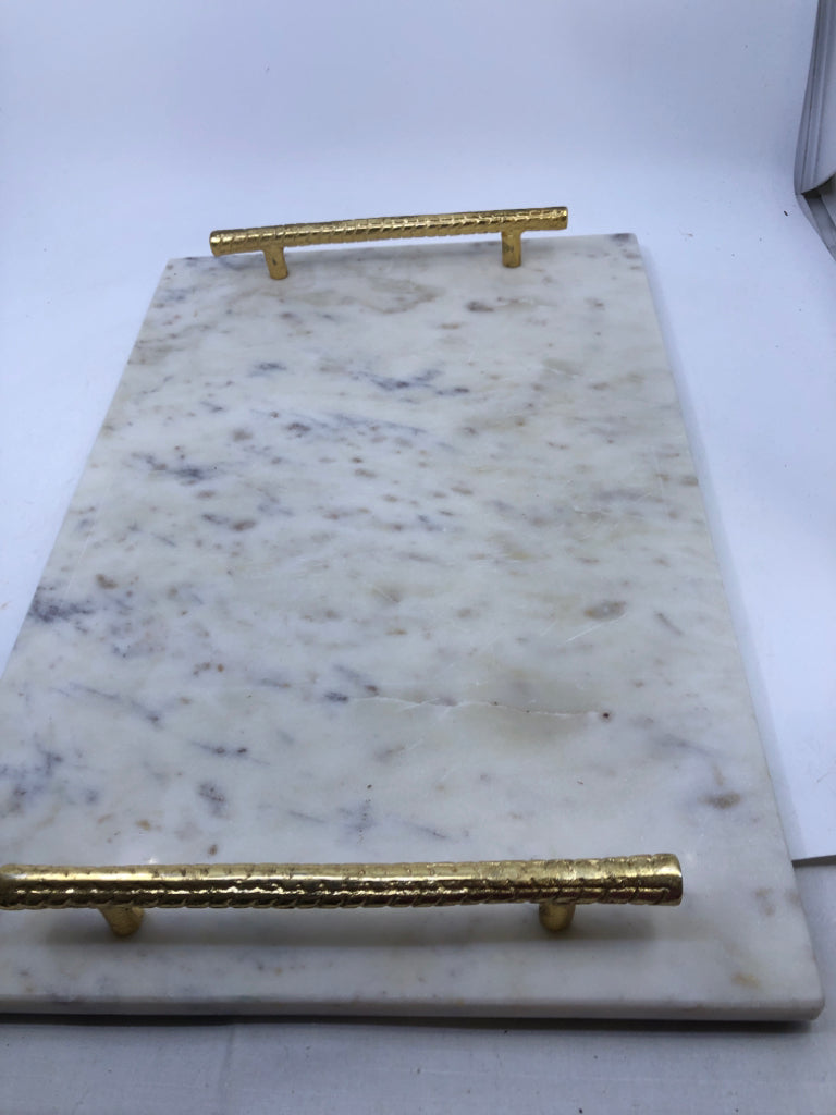 MARBLE, GOLD HANDLE CUTTING BOARD.