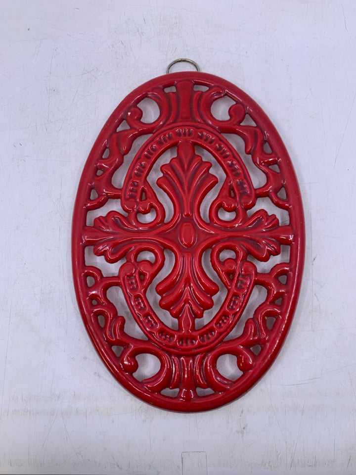 RED METAL SCROLL OVAL TRIVET.