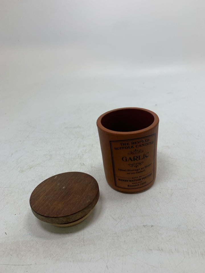 SMALL GARLIC CANISTER W/ WOOD TOP.