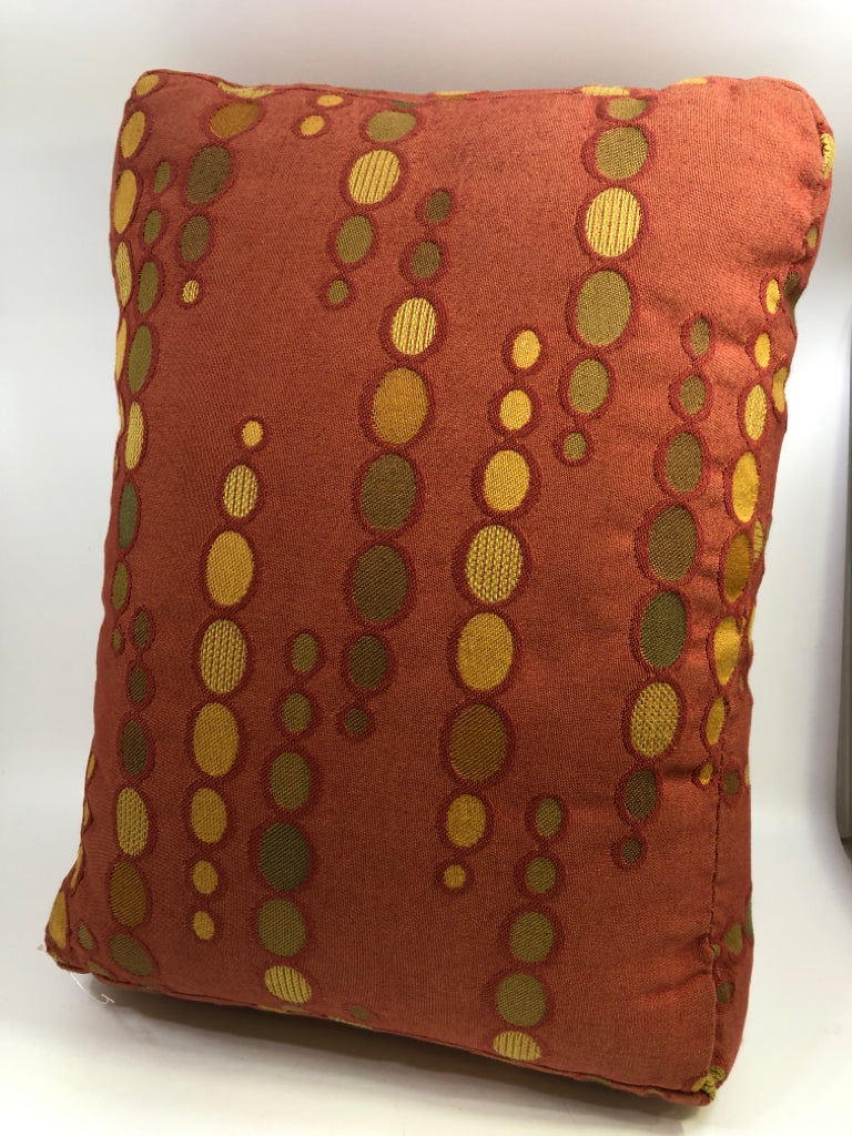 ORANGE RECTANGLE ACCENT PILLOW W/GREEN & YELLOW CIRCLES.