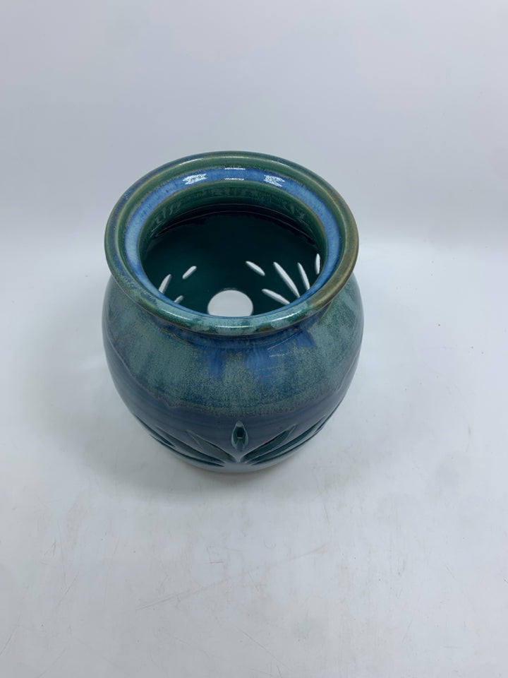 LEAF CUT-OUT BLUE GLAZED CANDLE HOLDER.