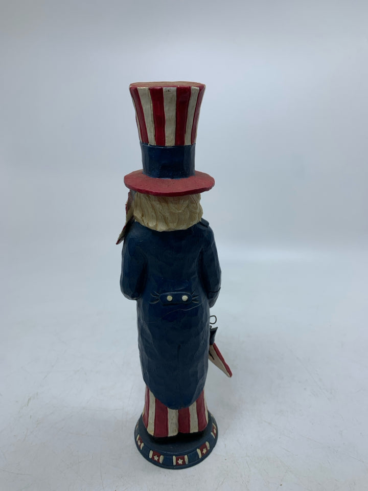 RESIN PATRIOTIC THEMED MAN HOLDING STAR/FLAG.
