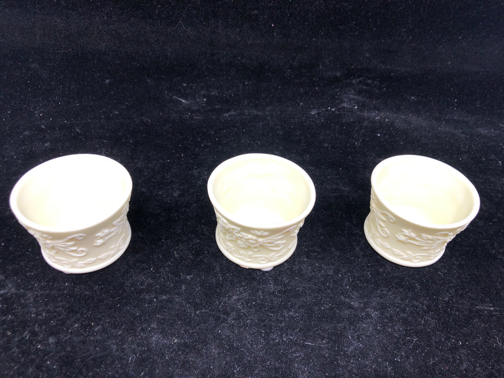 3 CREAM EMBOSSED YANKEE CANDLE TEALIGHT HOLDERS.