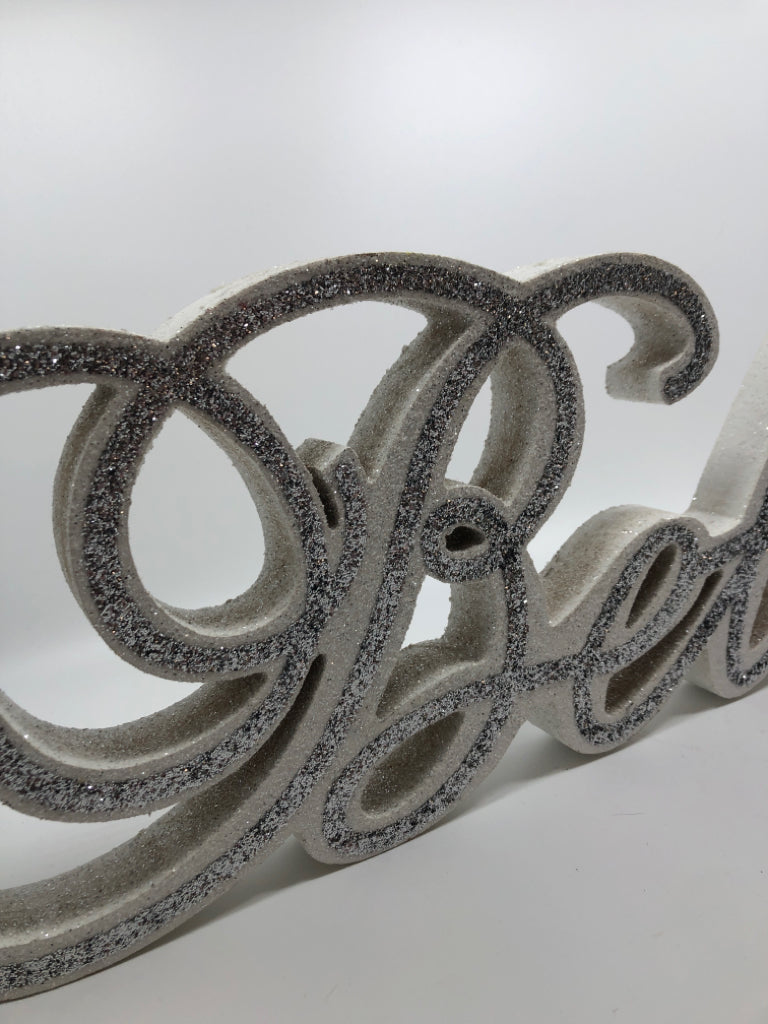 WHITE "BELIEVE" SILVER GLITTER SHELF SIGN.