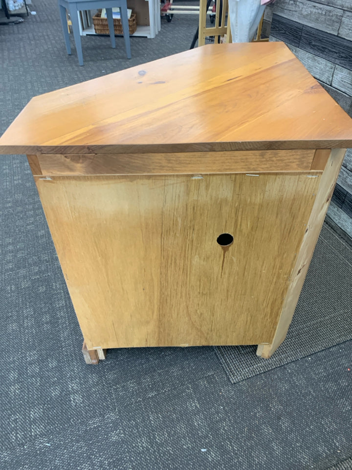 BLONDE WOOD CORNER CABINET.