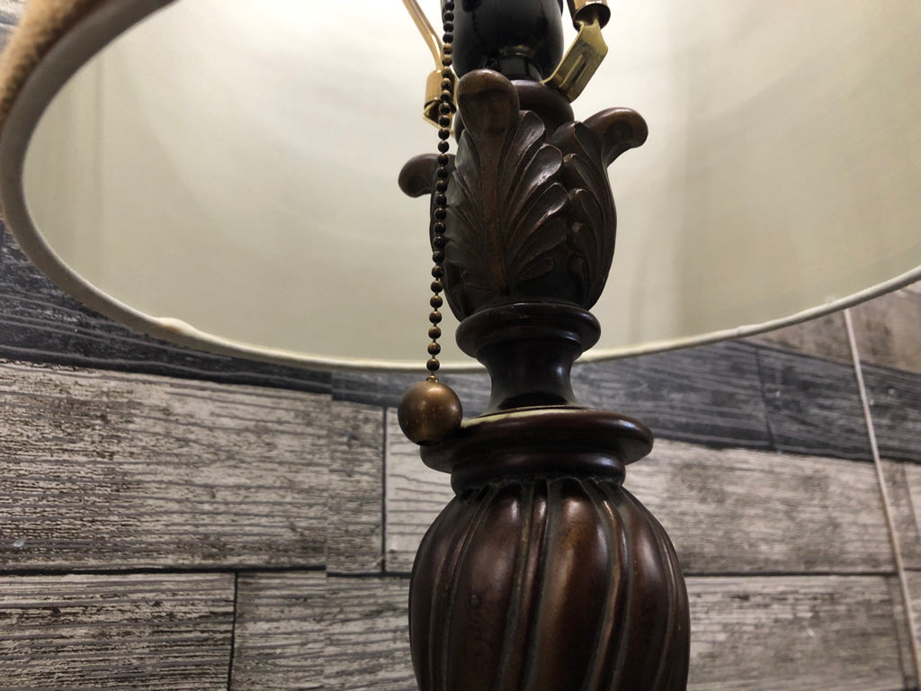 BRONZE SCROLL BASE LAMP W/BROWN SHADE.