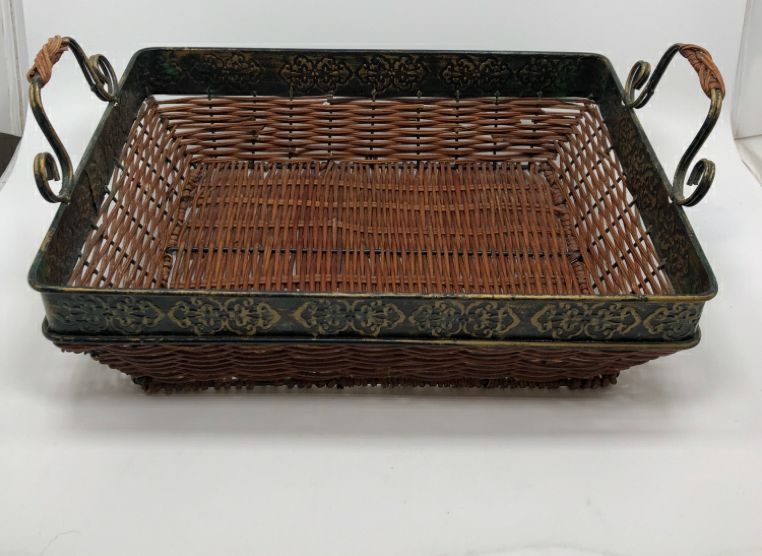 DRK BROWN RECTANGLE WICKER BASKET W/METAL SCROLL RIM AND HANDLES.