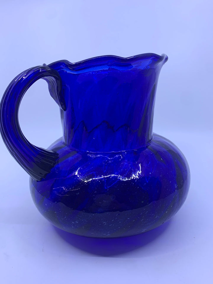 BLUE PITCHER WITH RIBBED HANDLE.