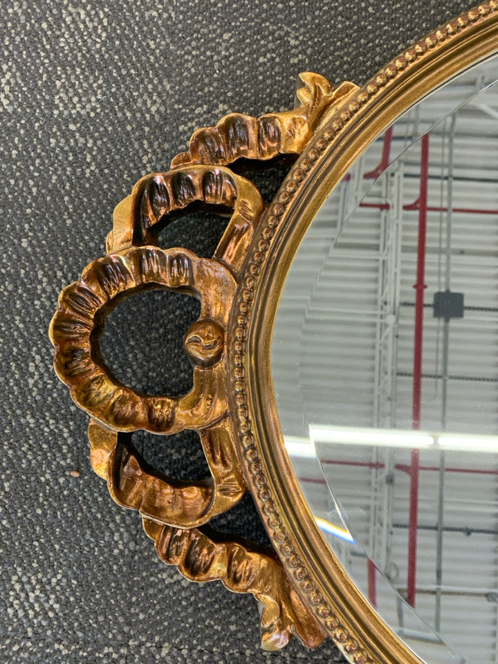 LARGE GOLD PAINTED MIRROR W/ BEADED EDGE W/ CUTOUT ON TOP.