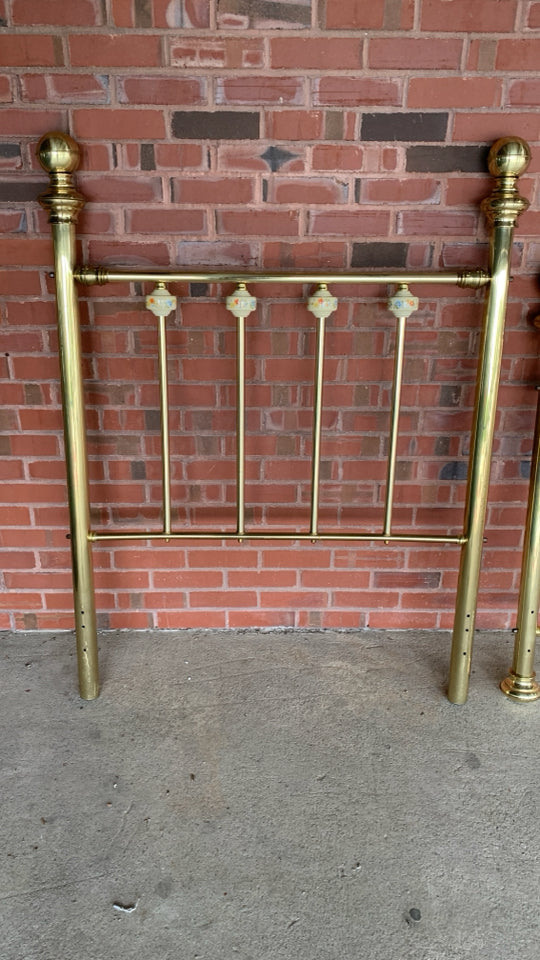BRASS TWIN BED FRAME W/CERAMIC FLORAL BALL DETAILS.