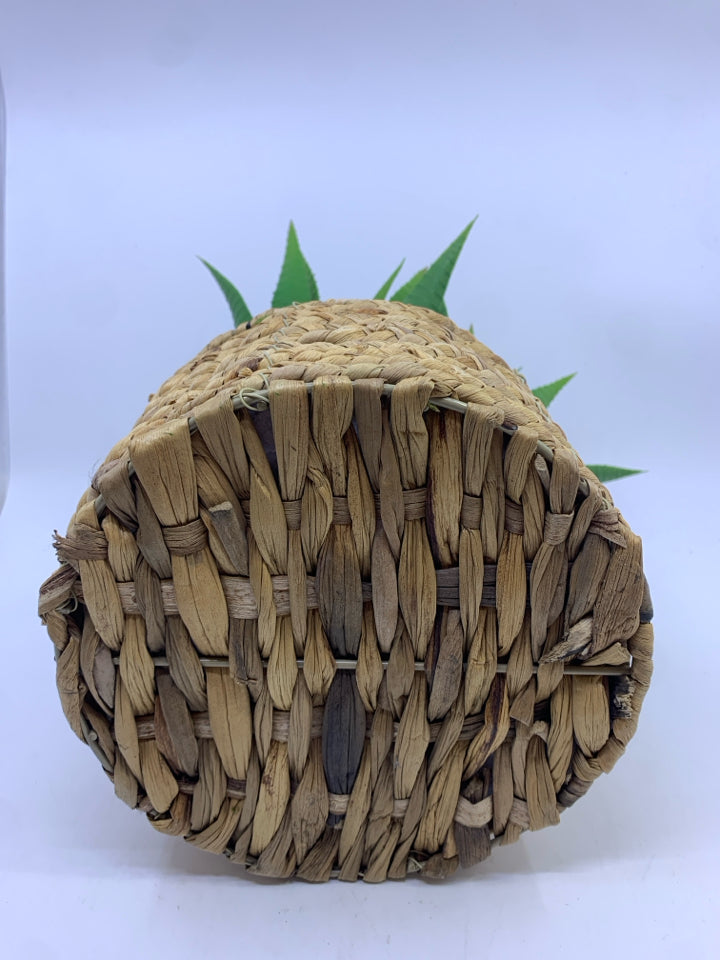 FAUX ALOE IN BLONDE WICKER BASKET.