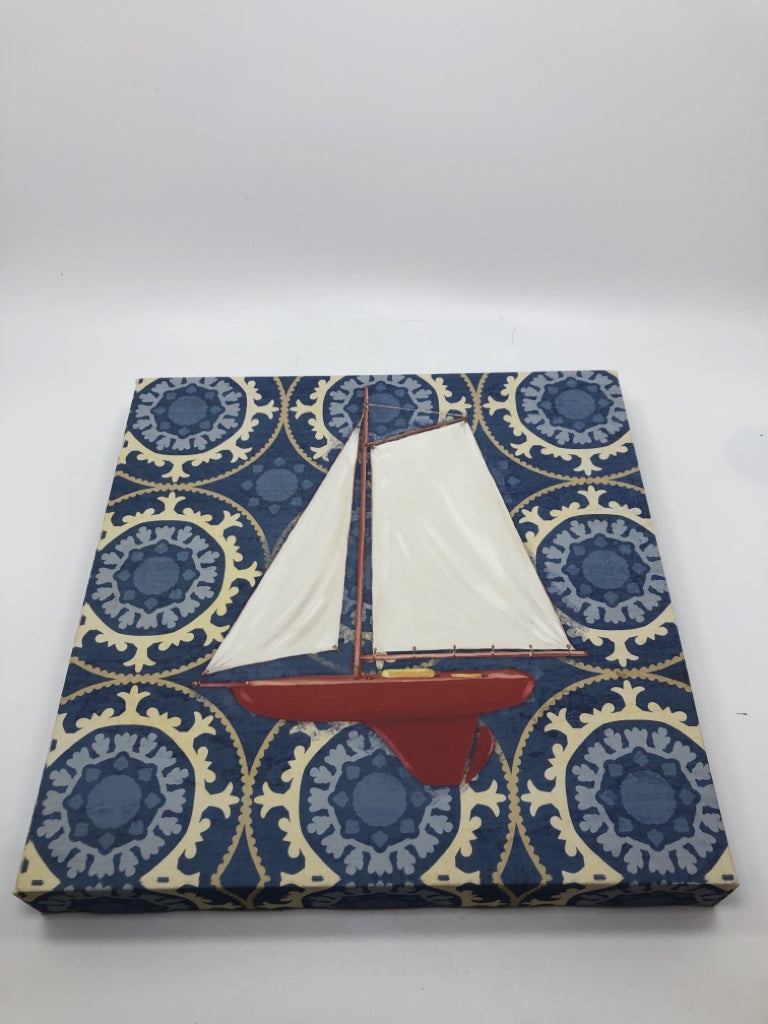 SAILBOAT PAINTED CANVAS ON BLUE BACKGROUND.