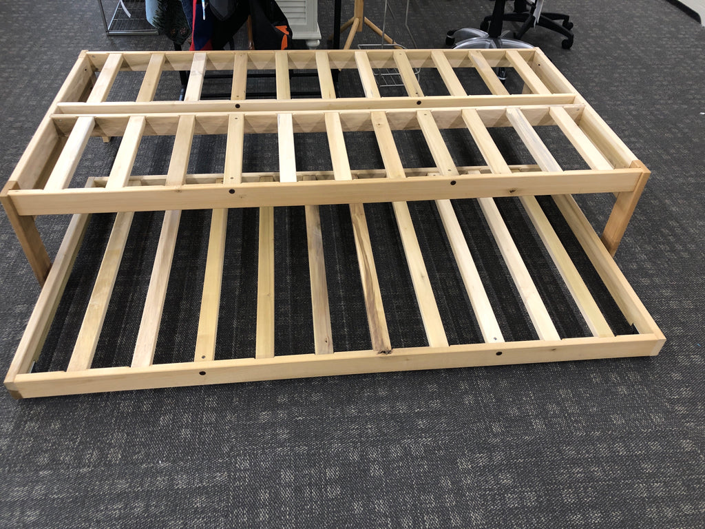 LIGHT WOOD TWIN PLATFORM WITH TRUNDLE BED.