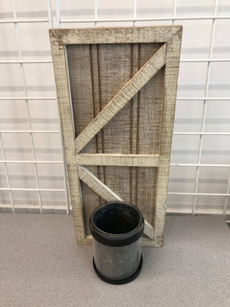 WHITE WASHED BARN DOOR W/ GALVANIZED CANDLE HOLDER WALL HANGING.