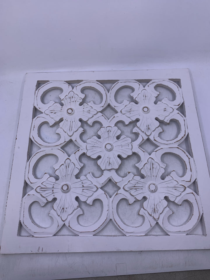 SQUARE WHITE WOOD CUTOUT WALL HANGING.
