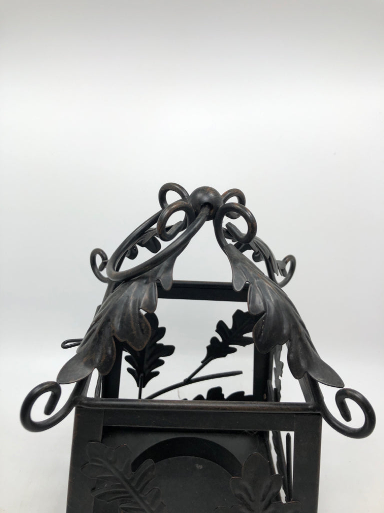 BLACK METAL LEAF EMBOSSED CANDLE LANTERN.