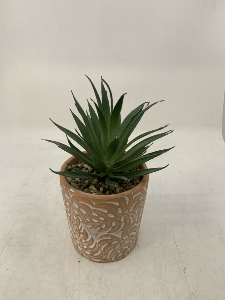 TERA COTTA PLANTER W/ SKINNY LEAVES + ROCK FILLER.