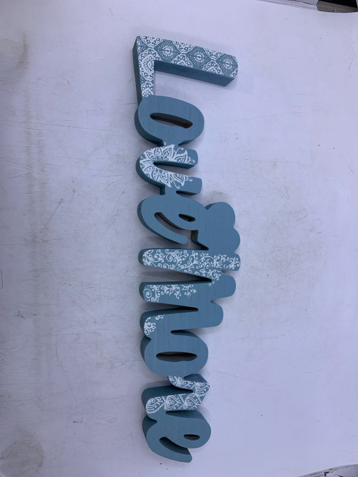 BLUE LOVE MORE WORDS SIGN.