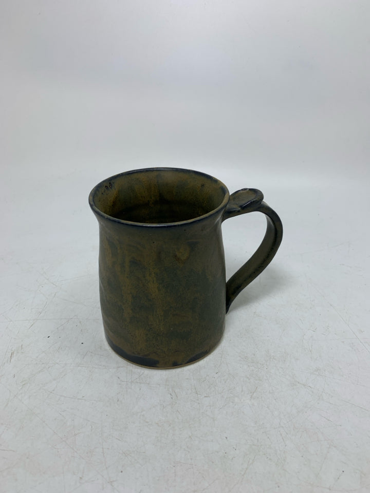 DARK COLORED POTTERY MUG.