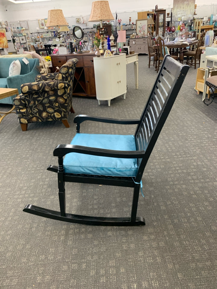 BLACK ROCKING CHAIR W TEAL CUSHION.
